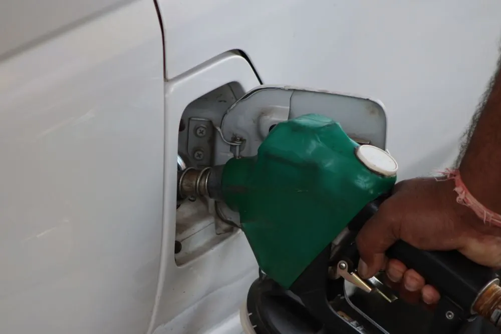 A fuel nozzle in a car's filler cap
